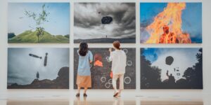 A senior couple walking through a bright, modern museum exhibit.