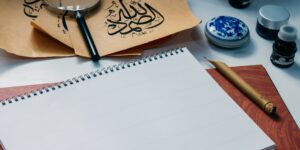 A serene workspace for calligraphy with a fountain pen and parchment.