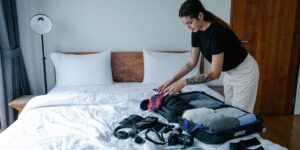 Open suitcase with organized packing cubes and comfortable travel gear for a cruise.