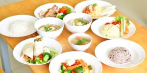 A healthy, balanced meal on a wooden table representing nutritional wellness for seniors.