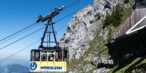 A scenic view of a modern funicular climbing a mountain, representing accessible travel.
