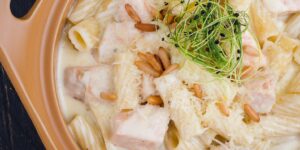 A collection of selenium-rich foods including Brazil nuts and salmon on a kitchen counter.