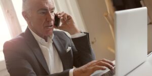 An older adult using a digital device to manage public services.